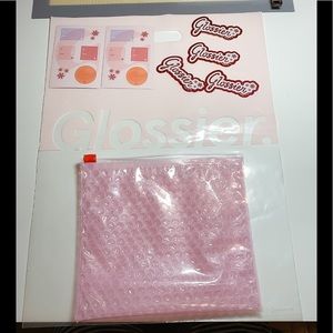 Glossier stickers bobble pouch.